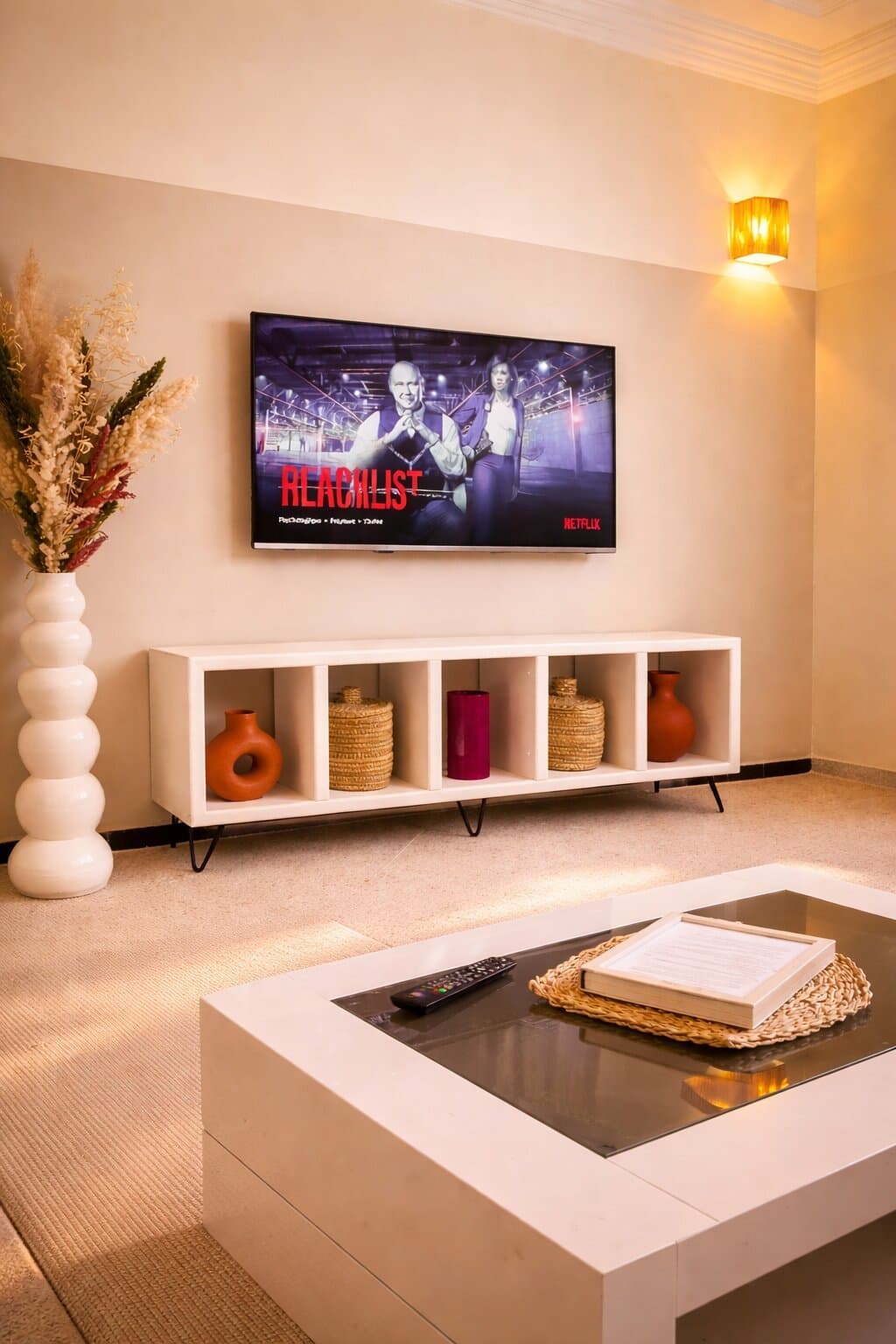 Living room TV area — Majorelle Balcony Apartment